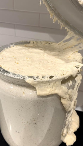 Made With Loave dough mixing captures hands-on activation for fresh bread.