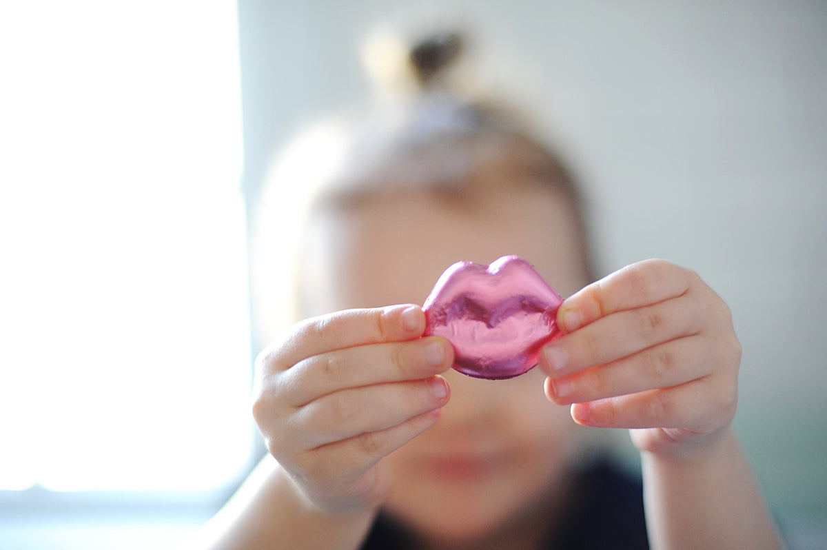 Madelaine Milk Chocolate Lips 12oz bag shown for bulk gifting