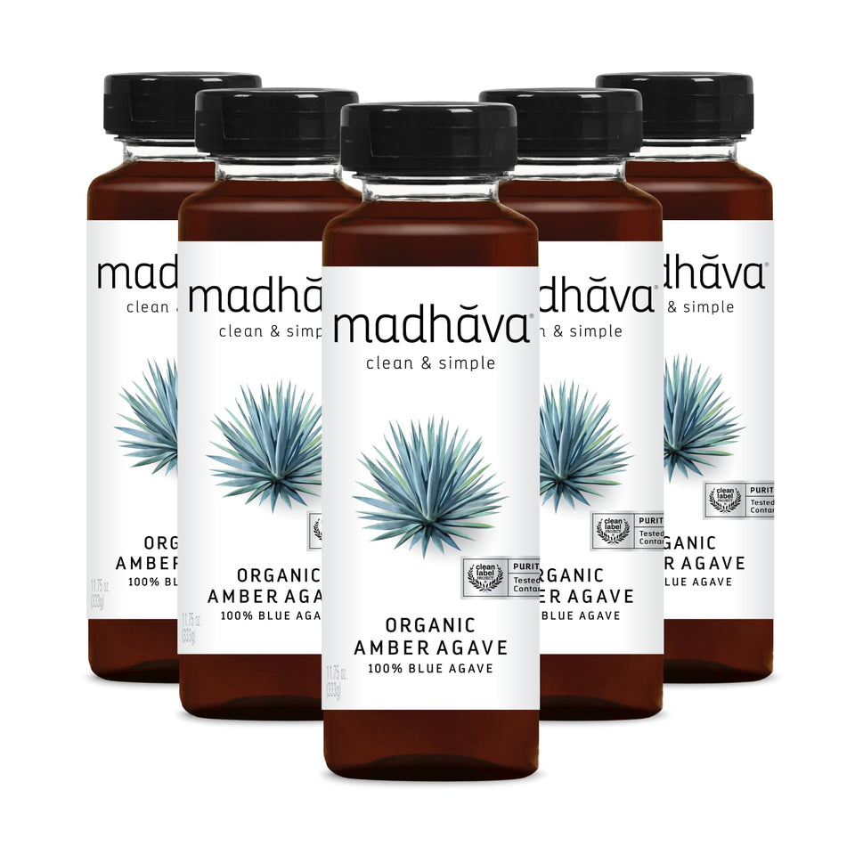 Madhava Amber Agave bottle with six-pack for clean, natural sweetness in beverages.
