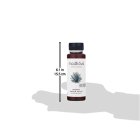 Madhava Blue Agave bottle beside measuring spoons for portion control.