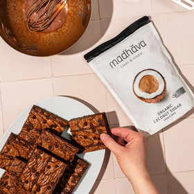 Madhava coconut sugar bag pour highlighting smooth sweetness for coffee and tea.