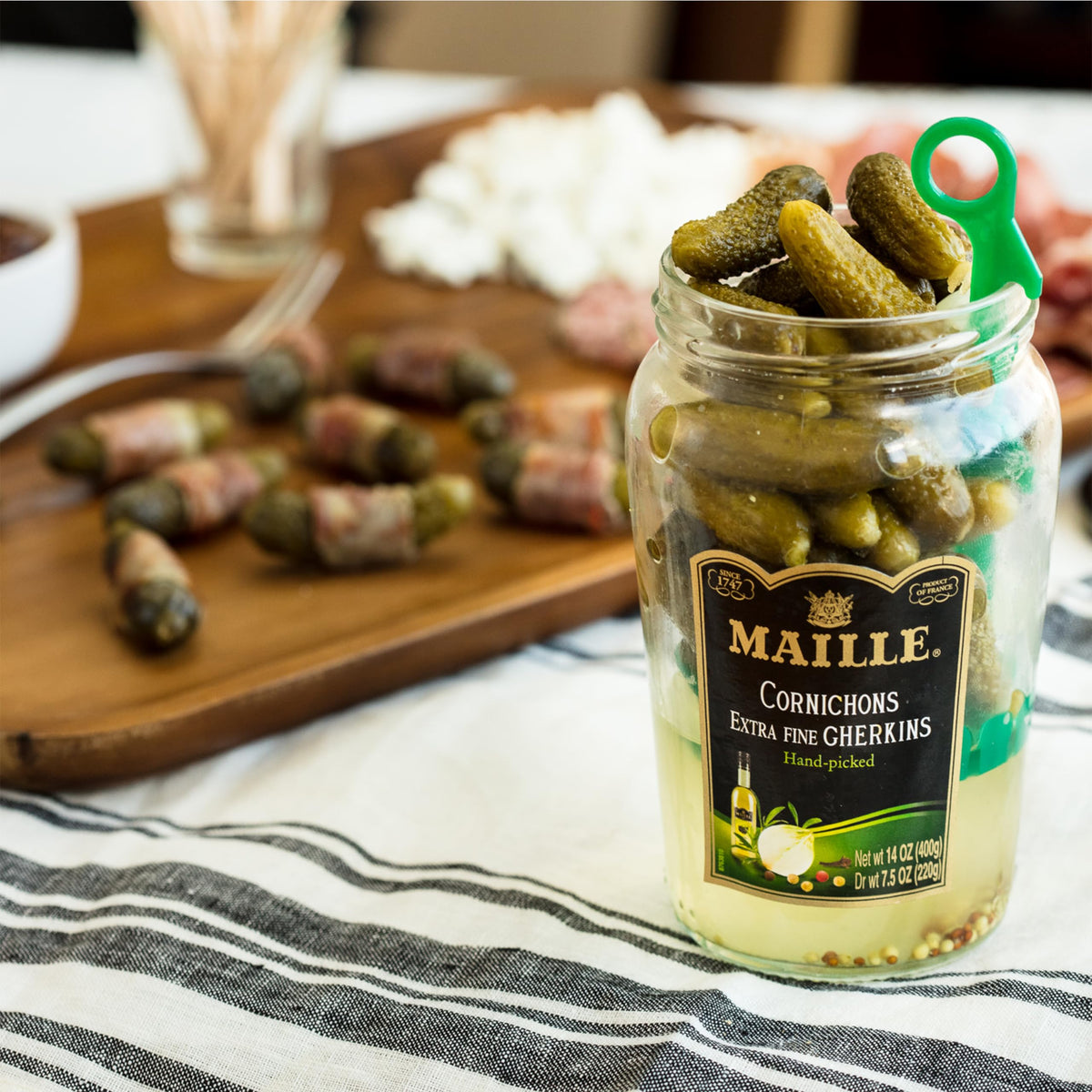 Maille Cornichons Original at the deli counter as versatile condiment.