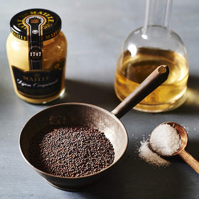 Maille Dijon Originale No Added Sulfites jar side, creamy texture ready to spread.