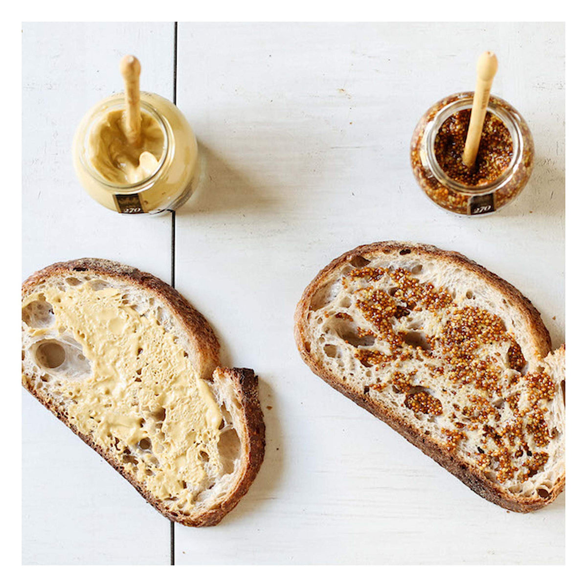 Maille Old Style mustard with whole seeds offering a grainy bite.