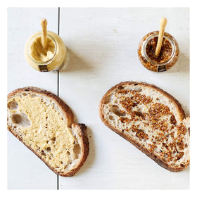 Maille Old Style mustard with whole seeds offering a grainy bite.