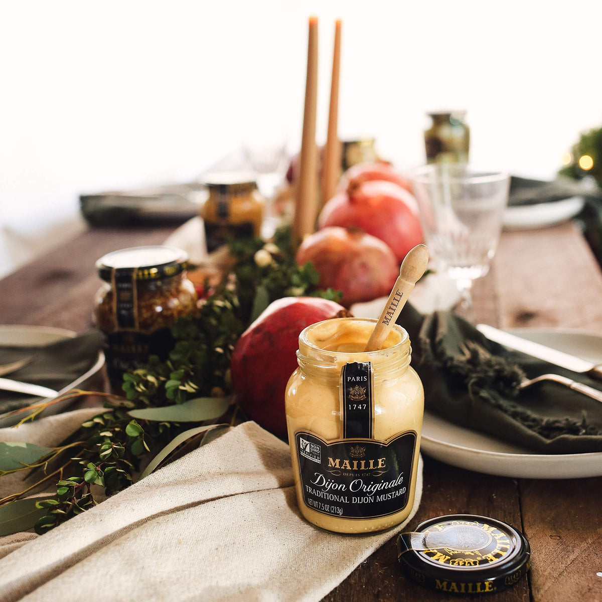 Maille Rich Country Dijon with creamy texture and seed flecks for chicken or fish.