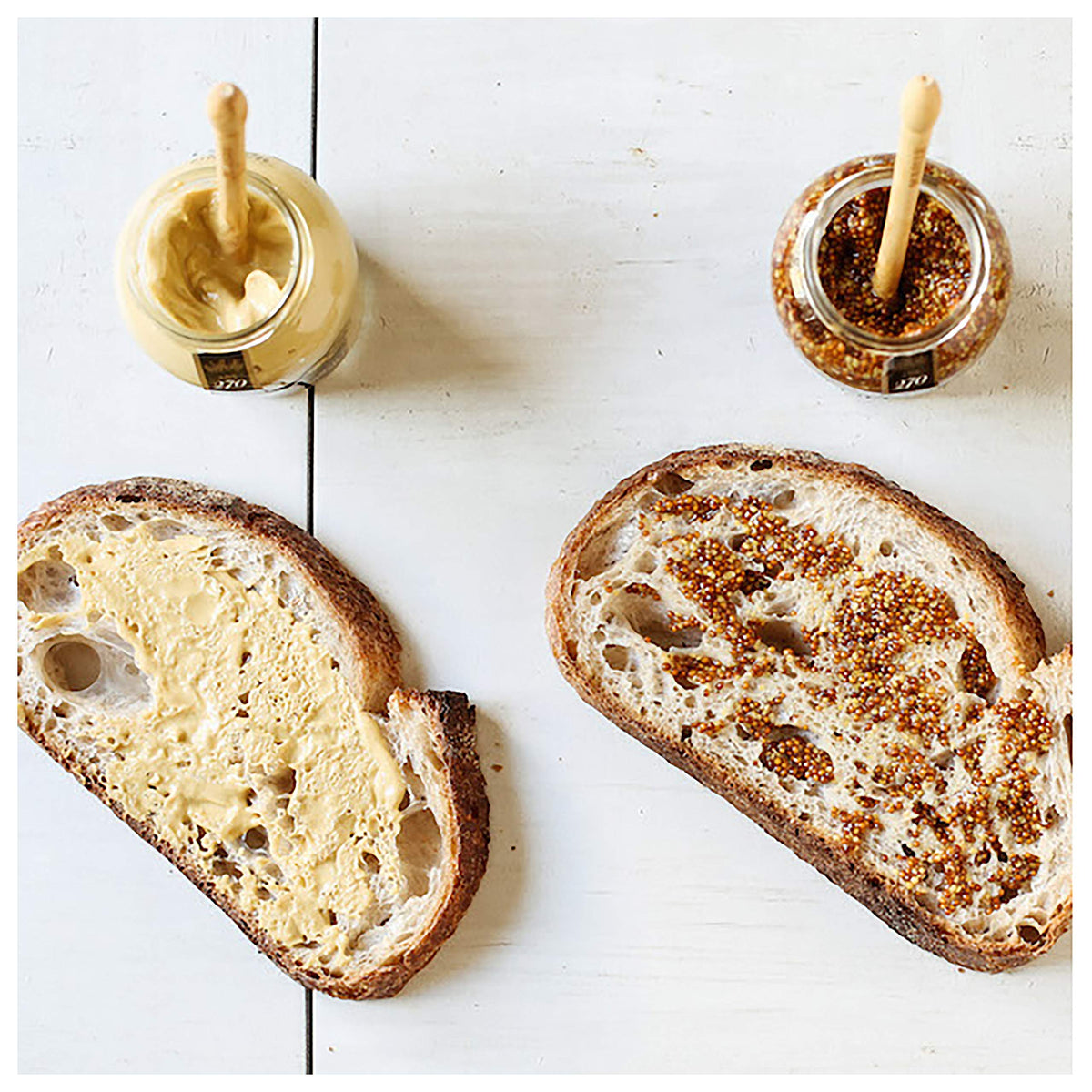 Open jar of Maille Rich Country Dijon showing its creamy consistency.