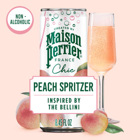 Glass of Chic Peach Spritzer over ice, highlighting refreshing aroma and elegant French style.