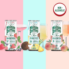 Maison Perrier Chic Pina Fizz bottle beside a chilled glass for tropical mocktails.