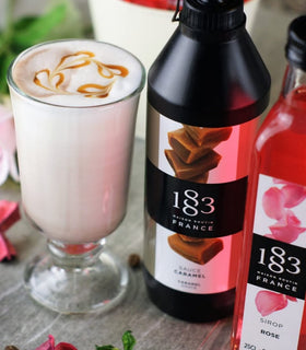 Dessert topping with 1883 Blackberry Syrup over cream