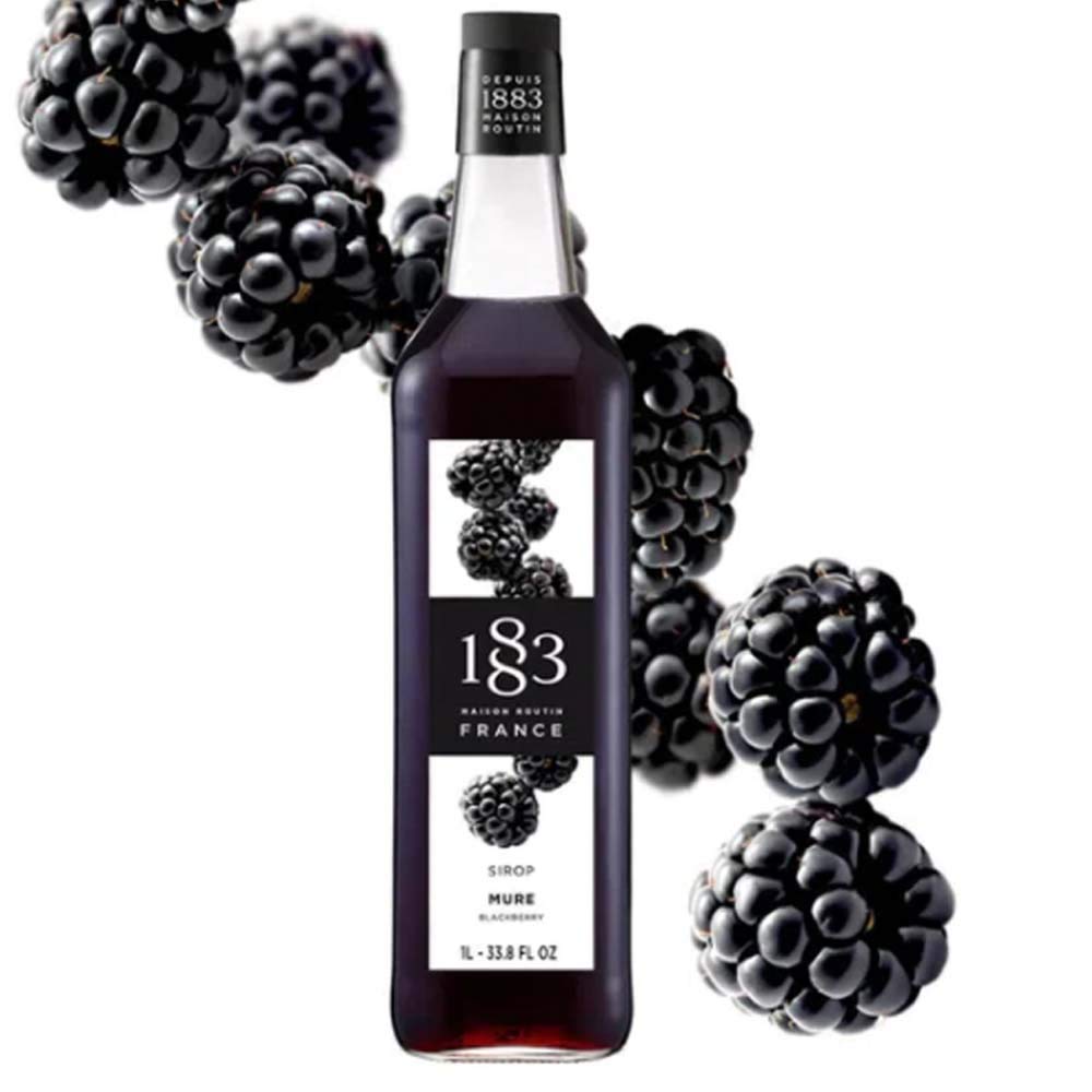 Close-up of 1883 Blackberry Syrup being poured into a glass