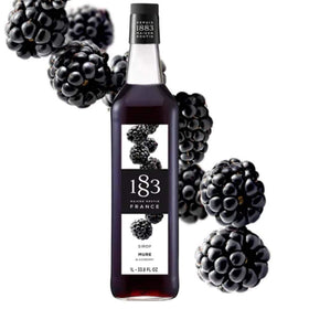 Close-up of 1883 Blackberry Syrup being poured into a glass