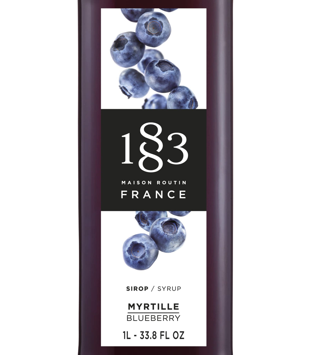 1883 MAISON ROUTIN Blueberry Syrup pour into glass showcases vibrant flavor boost.