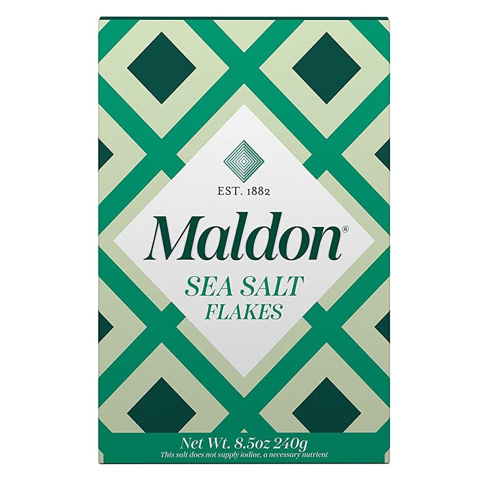 Maldon salt flakes close-up showing pyramid crystals for a crisp premium finish.