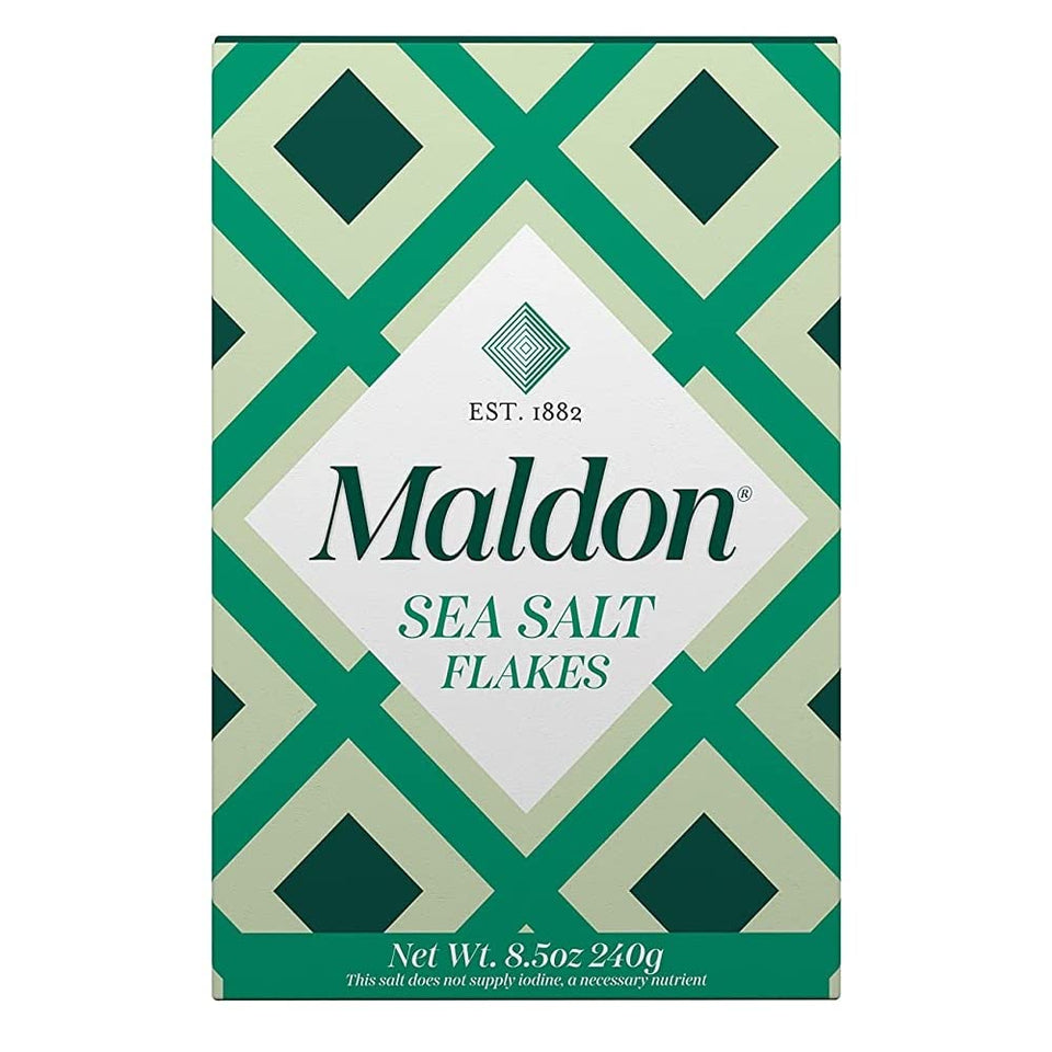 Maldon salt flakes close-up showing pyramid crystals for a crisp premium finish.