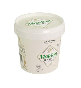 Maldon pyramid crystals closeup, delicate flakes melt for savor.
