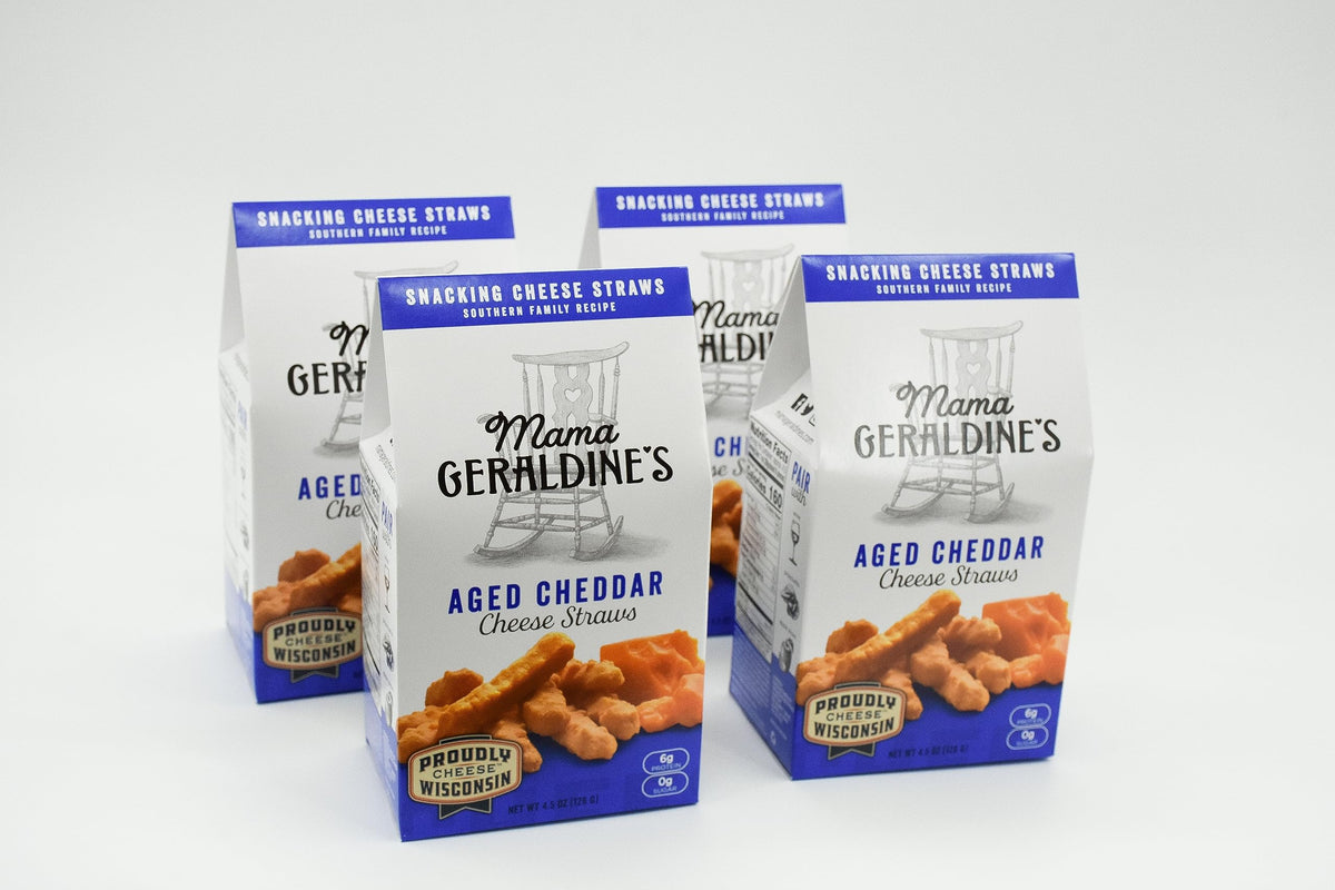 Mama Geraldine's aged cheddar cheese straws bag closeup, showing rich aroma and crisp texture.