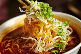 MAMA ramen noodles boiling in a pot for a fast meal