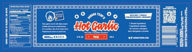 Mama Teav's Mild Garlic Chili Crisp being poured for a flavorful drizzle.