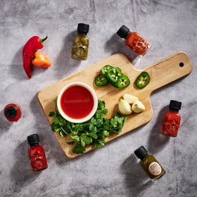 Man Crates Hot Sauce Inferno Flight gift set for men elevates gifting with a unique, spicy experience.