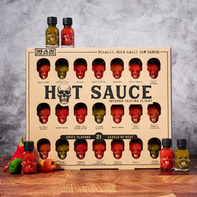 Man Crates Hot Sauce Inferno Flight enables spicy challenges without commitment to large bottles.