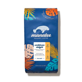 Manatee Gourmet Coffee Caribbean Delight beans reveal rich hazelnut and coconut notes in a premium Arabica blend.
