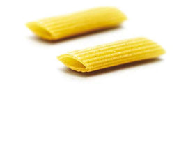 Raw Mancini Penne dried pasta with ridged tubes designed to hold sauce