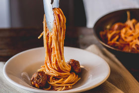 Mancini packaging highlights non-GMO and Buona Pratica Agricola standards.