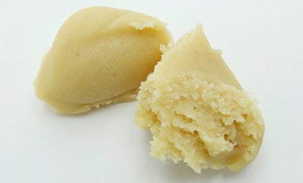 Close-up of Mandelin paste texture highlighting smooth, creamy consistency for pastries.