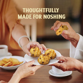 Gluten-free and dairy-free icons accompany Manischewitz macaroons, meeting dietary needs without compromising flavor.
