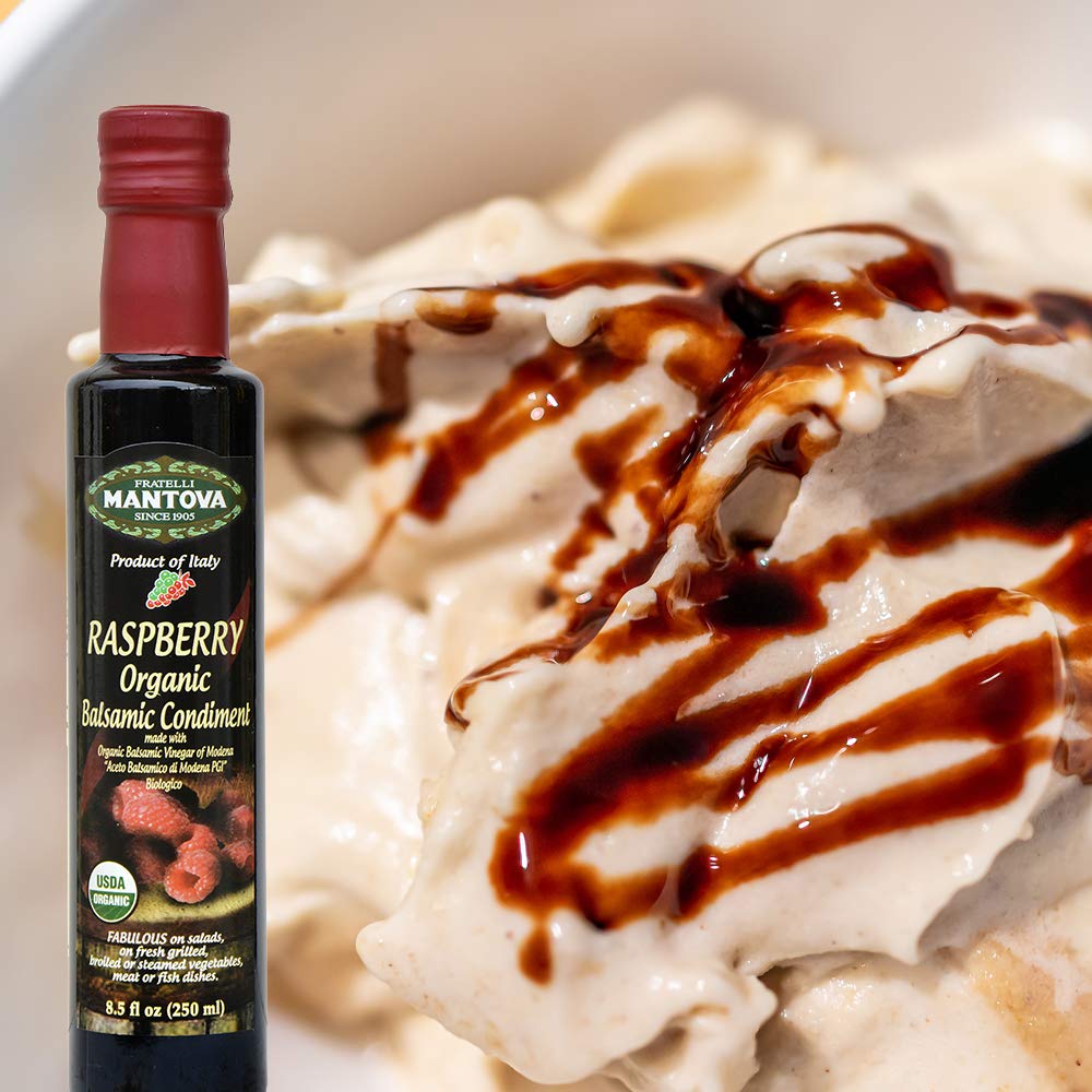Mantova Fratelli Raspberry Organic Balsamic drizzle on a cheese board
