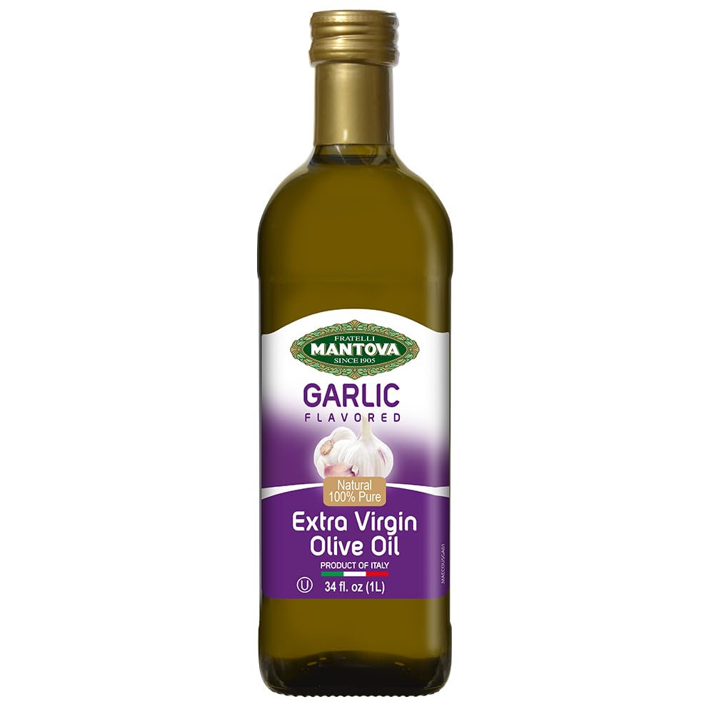 Mantova Garlic EVOO bottle being poured for rich salad dressing.