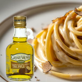 Glass bottle of Mantova Grand’Aroma truffle olive oil on a kitchen counter