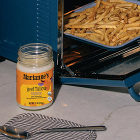 Marianne's Harvest beef tallow packaging on a kitchen shelf.