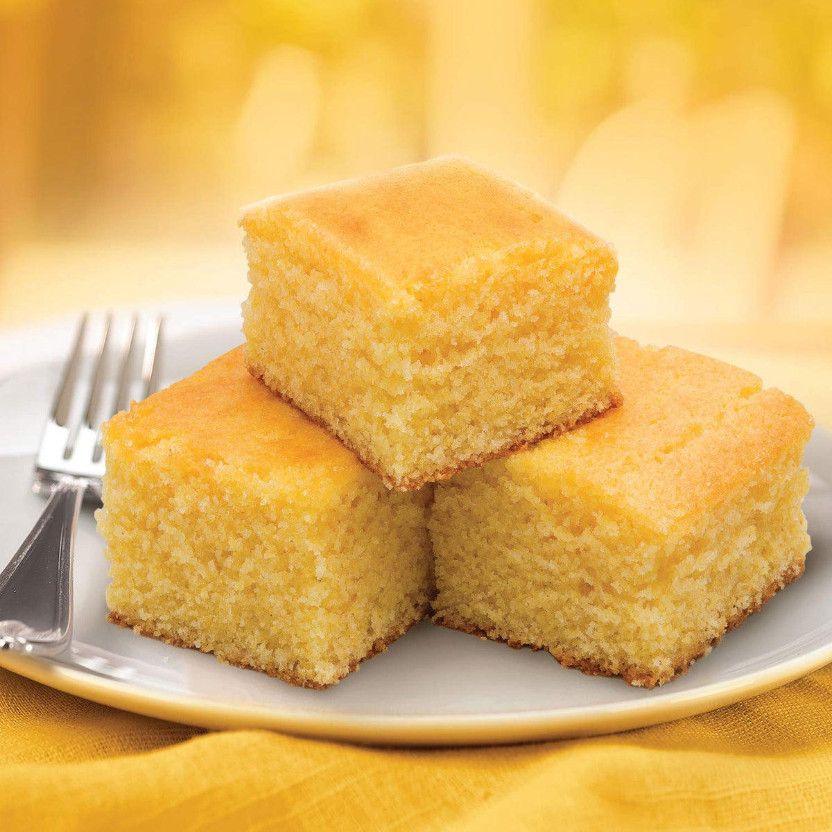 Marie Callender's Cornbread Mix being poured into a pan for an easy water-only recipe.