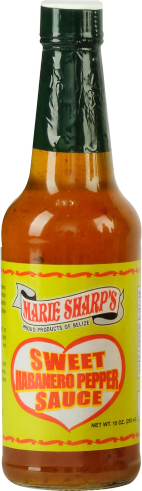 Marie Sharp's Sweet Habanero sauce bottle on a wooden table for versatile flavor
