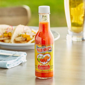Marie Sharp's Fiery Hot Habanero sauce on tacos for bold taste.