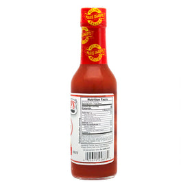 Marie Sharp's Hot Habanero Sauce label closeup — recognizable Belizean brand with a family-owned story