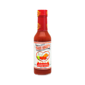 Close-up of Marie Sharp's Hot Habanero pour highlighting bold heat for grilled meat