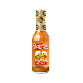 Close-up of label highlighting fresh mango and peppers for bold Belizean taste.