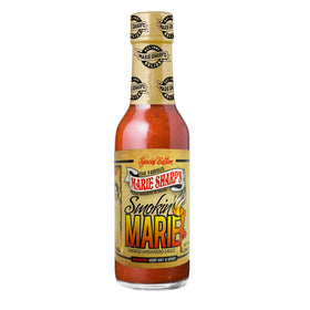 Smokin’ Marie sauce closeup, vibrant Belizean label and color signaling handcrafted flavor.