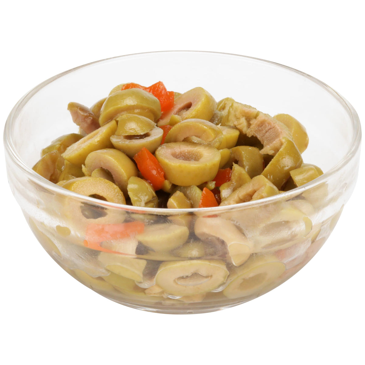 Mario Camacho Manzanilla olives plated beside fresh greens and tomatoes.