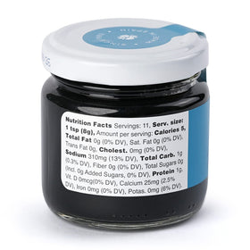 Close-up of Marky's squid ink bottle for rich seafood color