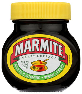 Marmite yeast extract bottle on toast, a savory breakfast option.
