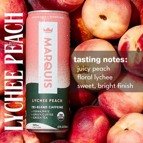 Marquis energy bubbles splash in glass showing sparkling Lychee Peach flavor.