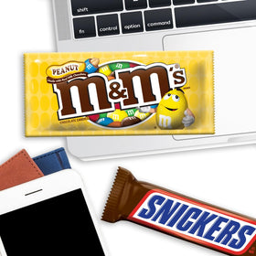 Mars Snickers bar on display, rich nougat and caramel flavor in full-size format.