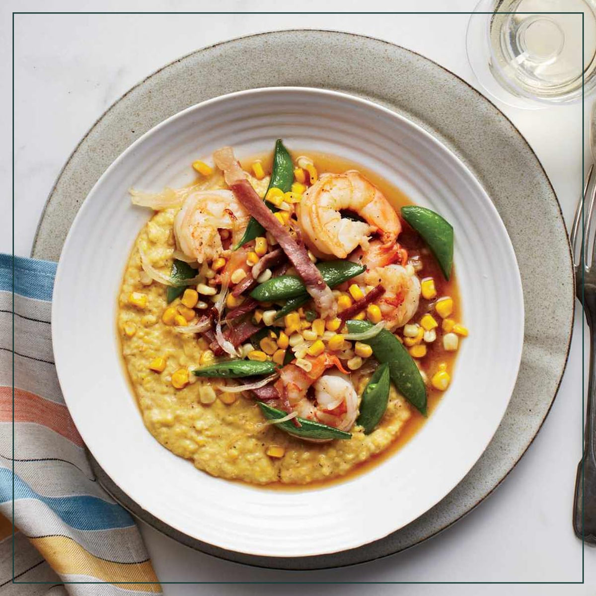 Measuring cup pours Marsh Hen Mill Sea Island Yellow Grits into a pot