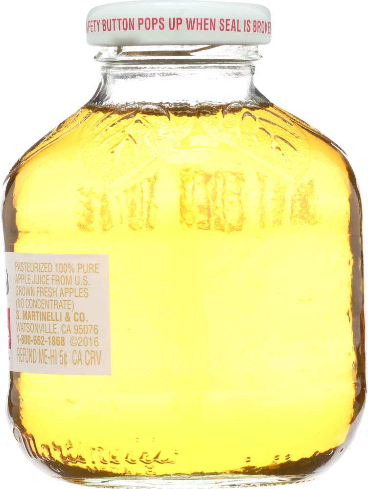 Pouring Martinelli's Apple Juice into a glass for serving.