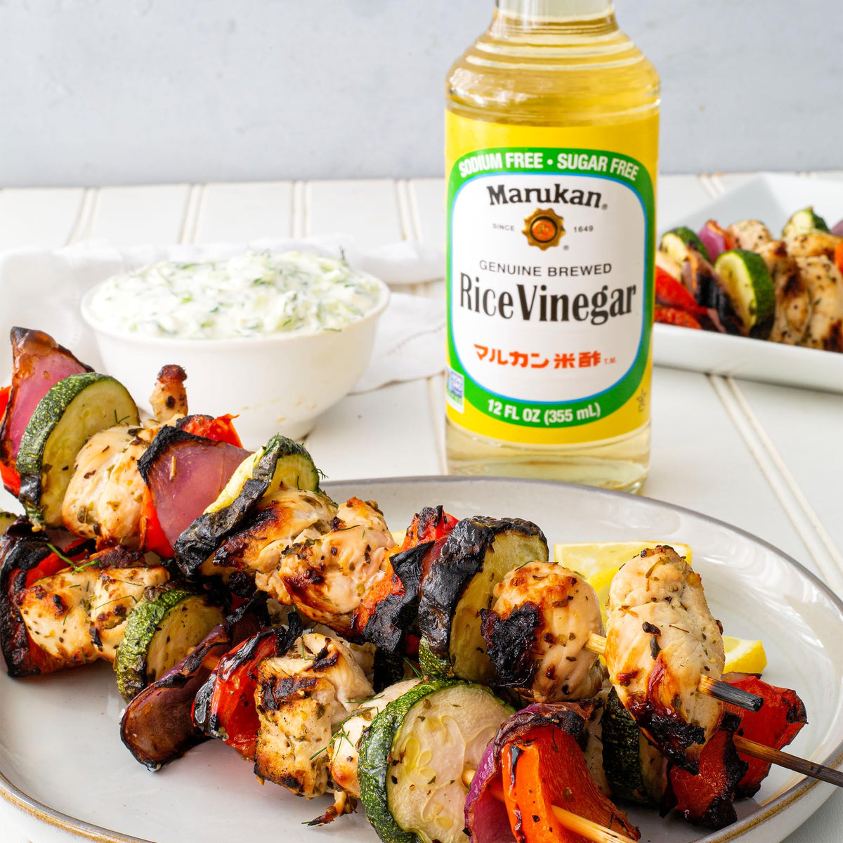 Marukan rice vinegar in a glass bottle on the counter signals vegan-friendly staple.
