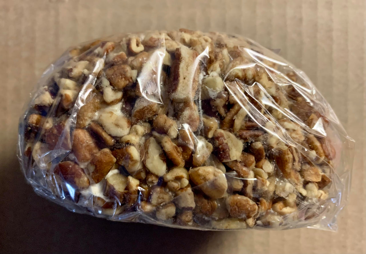 Mary Sue Pecan Nougat Egg close-up highlights premium pecans and chewy nougat texture.
